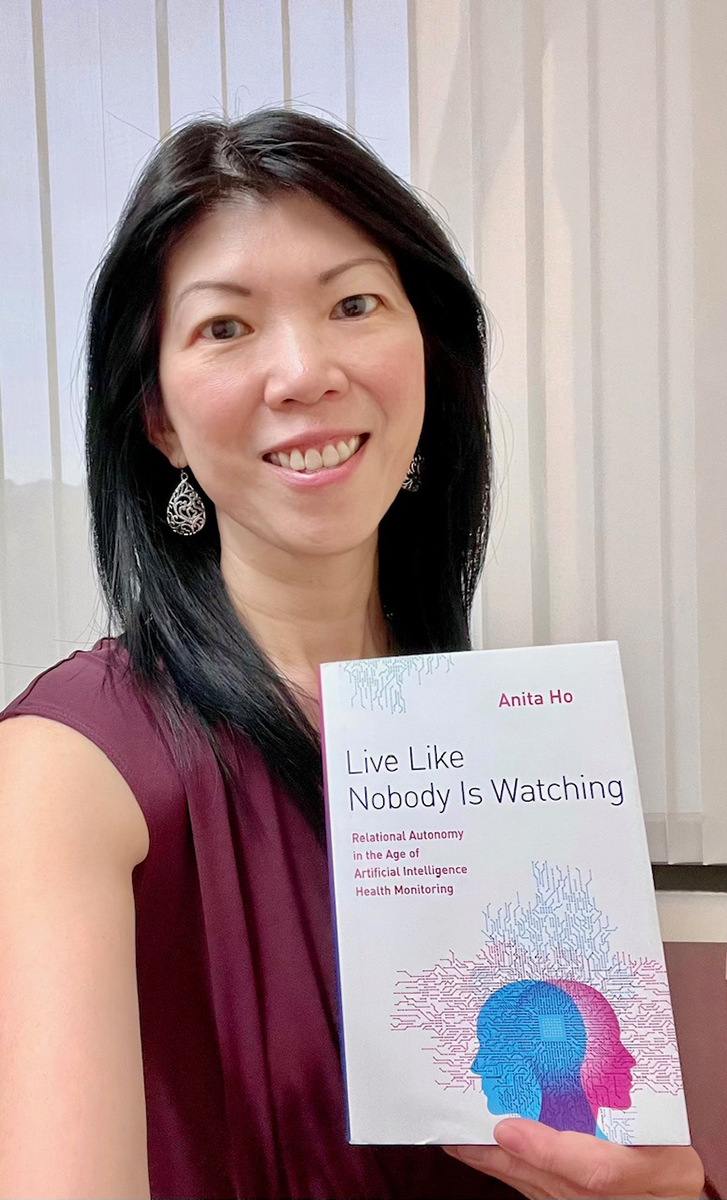 Advancing Health Scientist Dr. Anita Ho with her published book.